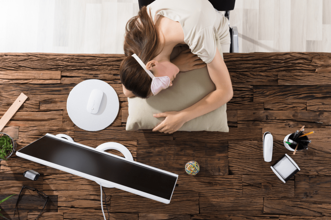 How to get back on track after an all nighter - photo of girl sleeping at her desk