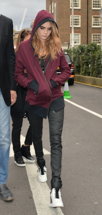 Cara Delevingne hoodie and leather leggings