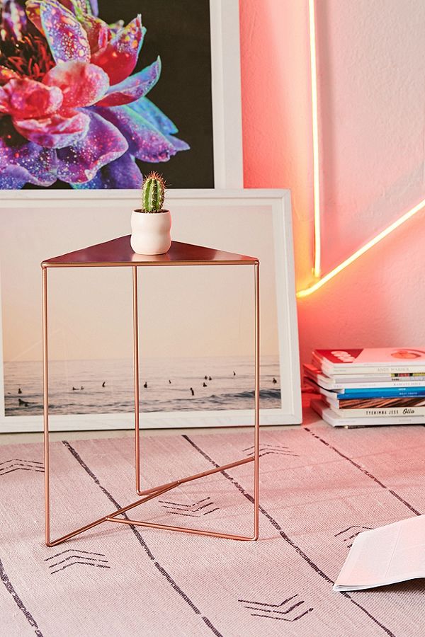 Dorm room furniture - Simple bronze triangle nightstand from Urban Outfitters.