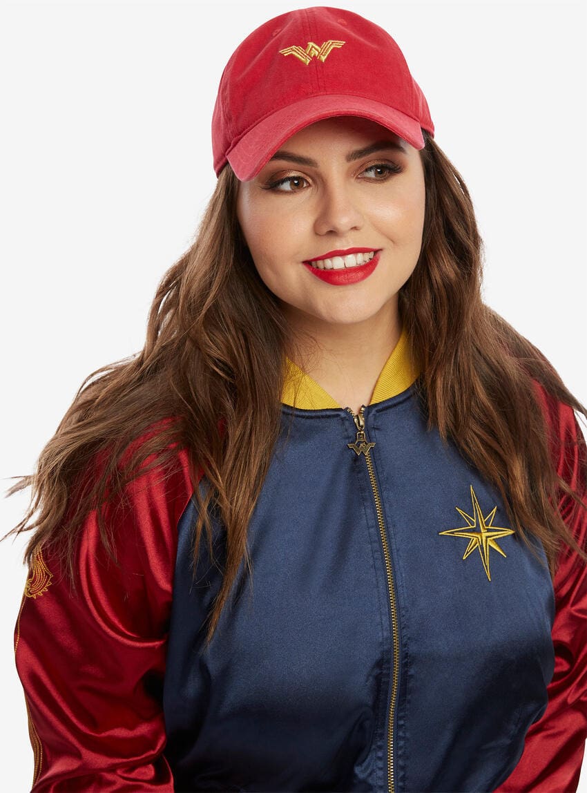 Red distressed baseball cap with embroidered Wonder Woman logo on the front. The brim is curved and the back strap is adjustable.