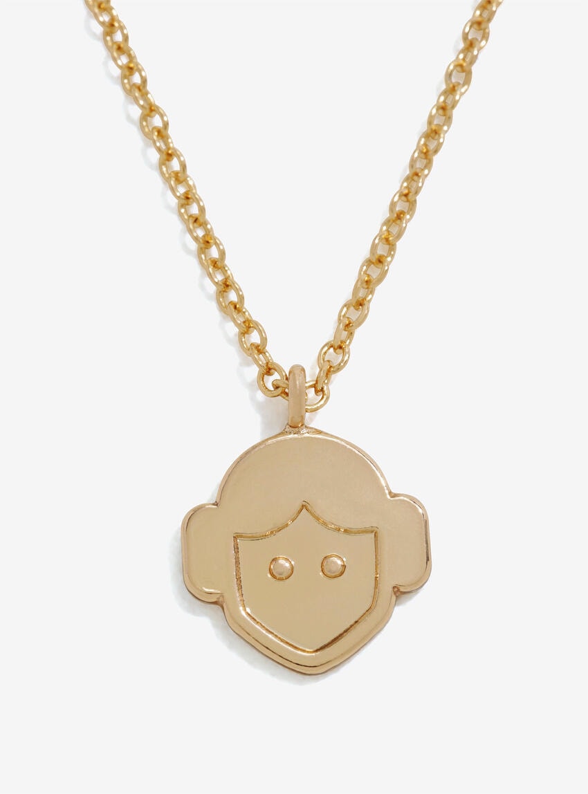 Metal gold tone necklace featuring cartoon Princess Leia head.