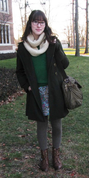 Winter street fashion at Ball State University - student wearing a sweater, knit scarf, tights, skirt, warm coat, and ankle booties