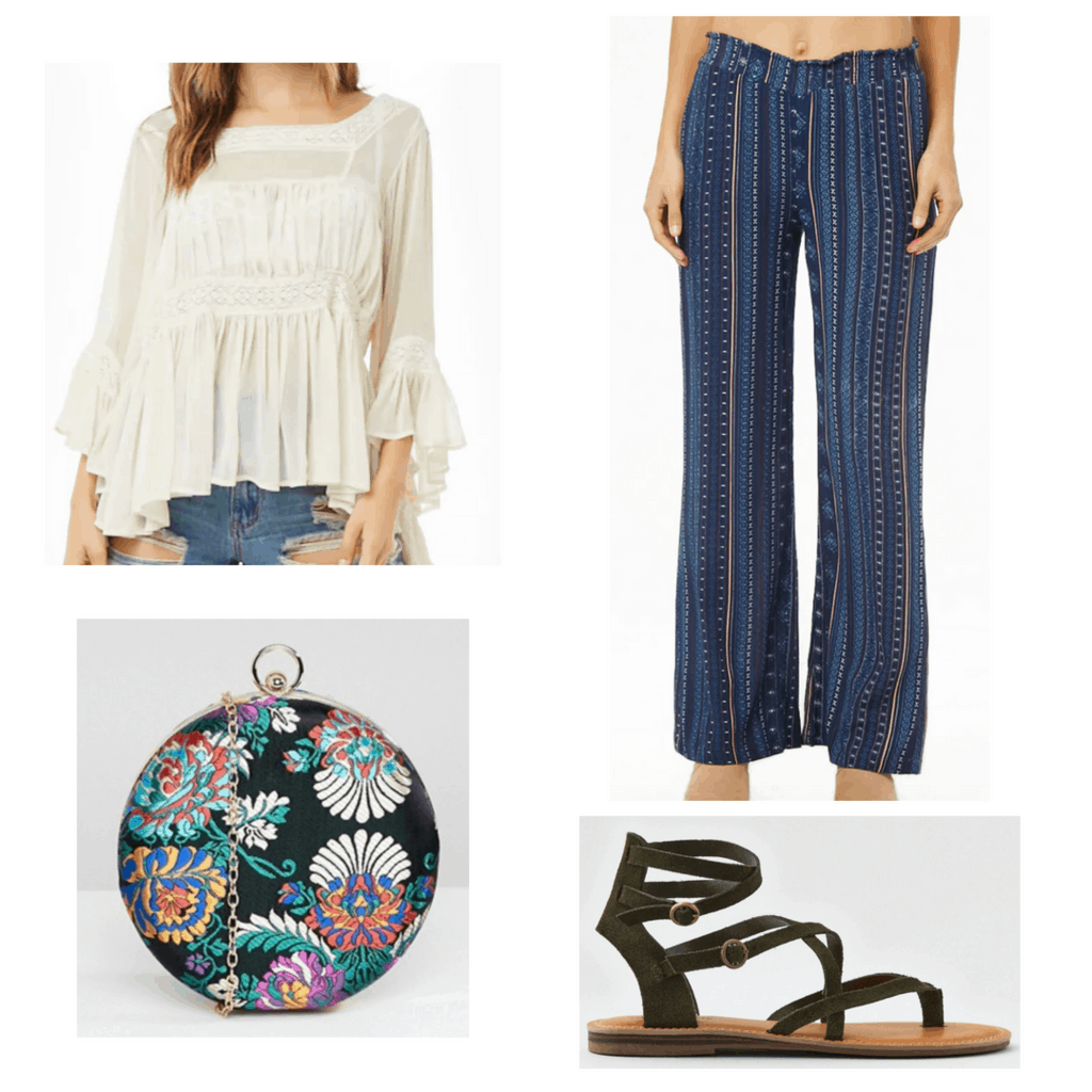 White bell sleeve top with blue wide leg pants, printed bag and green sandals