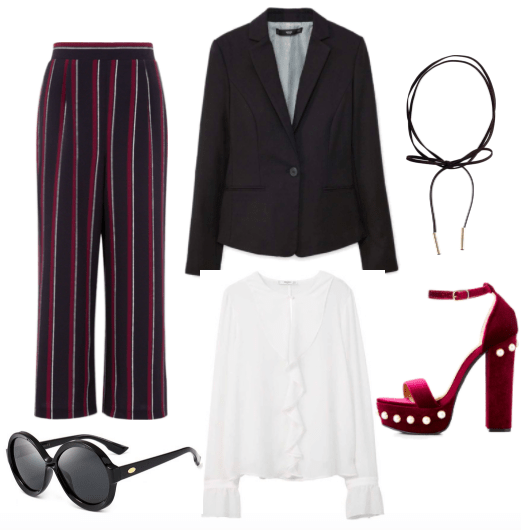 Burgundy and black vertical striped wide leg cropped trousers, a black blazer, a black bow leather choker, large black round sunglasses, a ruffled white satin blouse, and burgundy platform heels with circular gold embellishments.