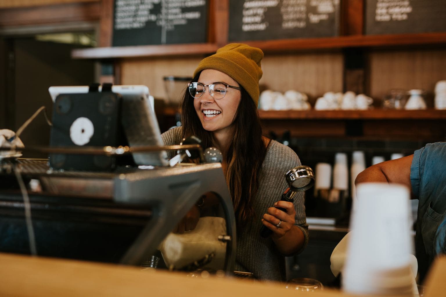 A college student working as a barista.