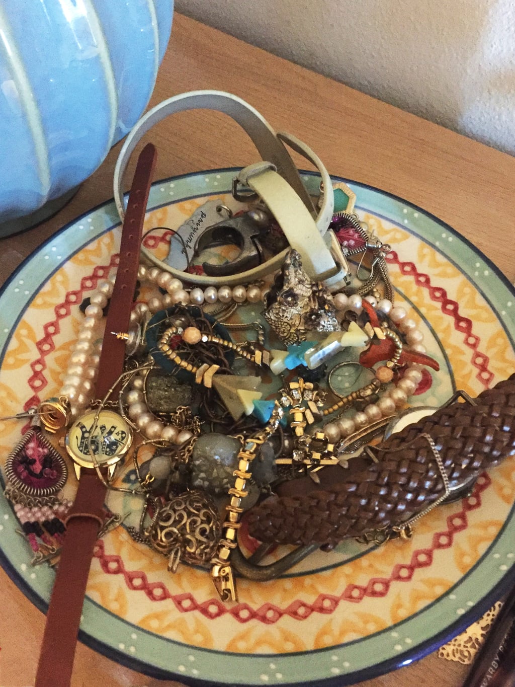 Catchall bowl/plate used to hold jewelry in an apartment