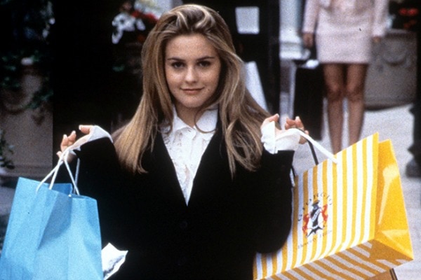 Cher from Clueless holding shopping bags