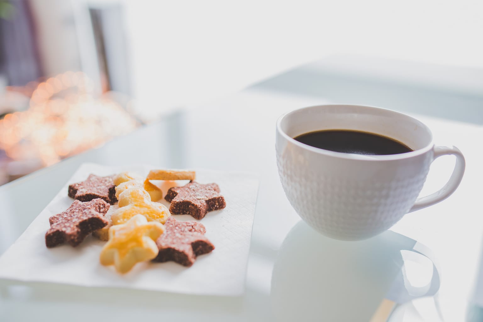 Christmas treats: Star shaped holiday cookies and a cup of coffee