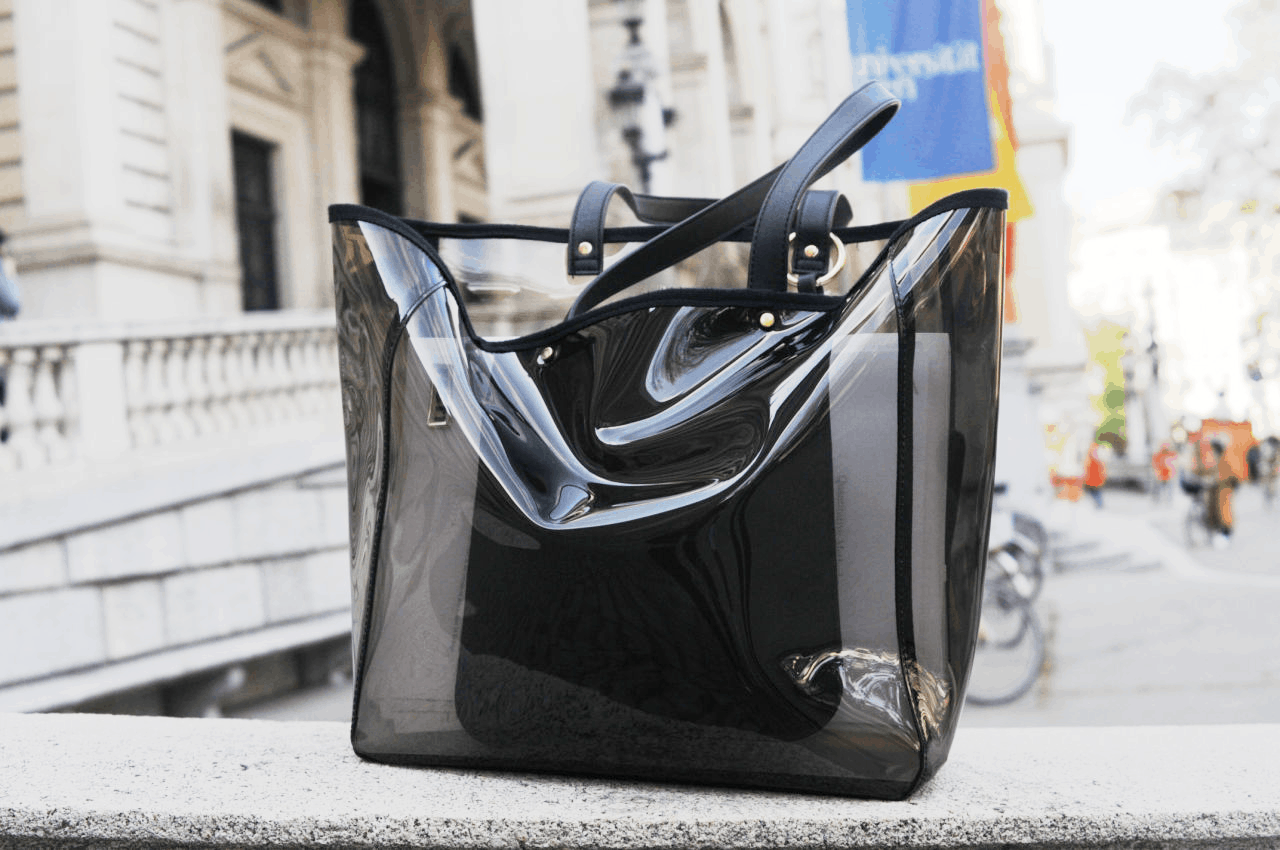 A clear black PVC tote bag on campus at University of Vienna -- perfect trendy bag for school