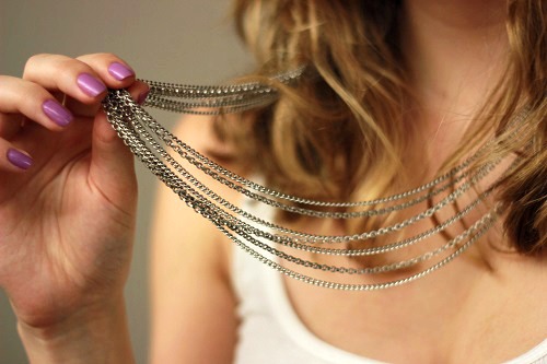 College fashionista wearing a layered necklace