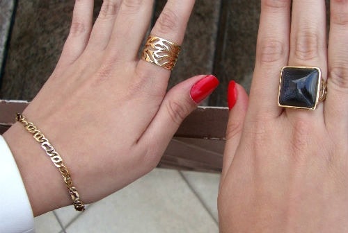 College fashionista wearing gold statement jewelry