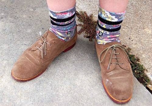 College student wearing printed socks and brown oxfords