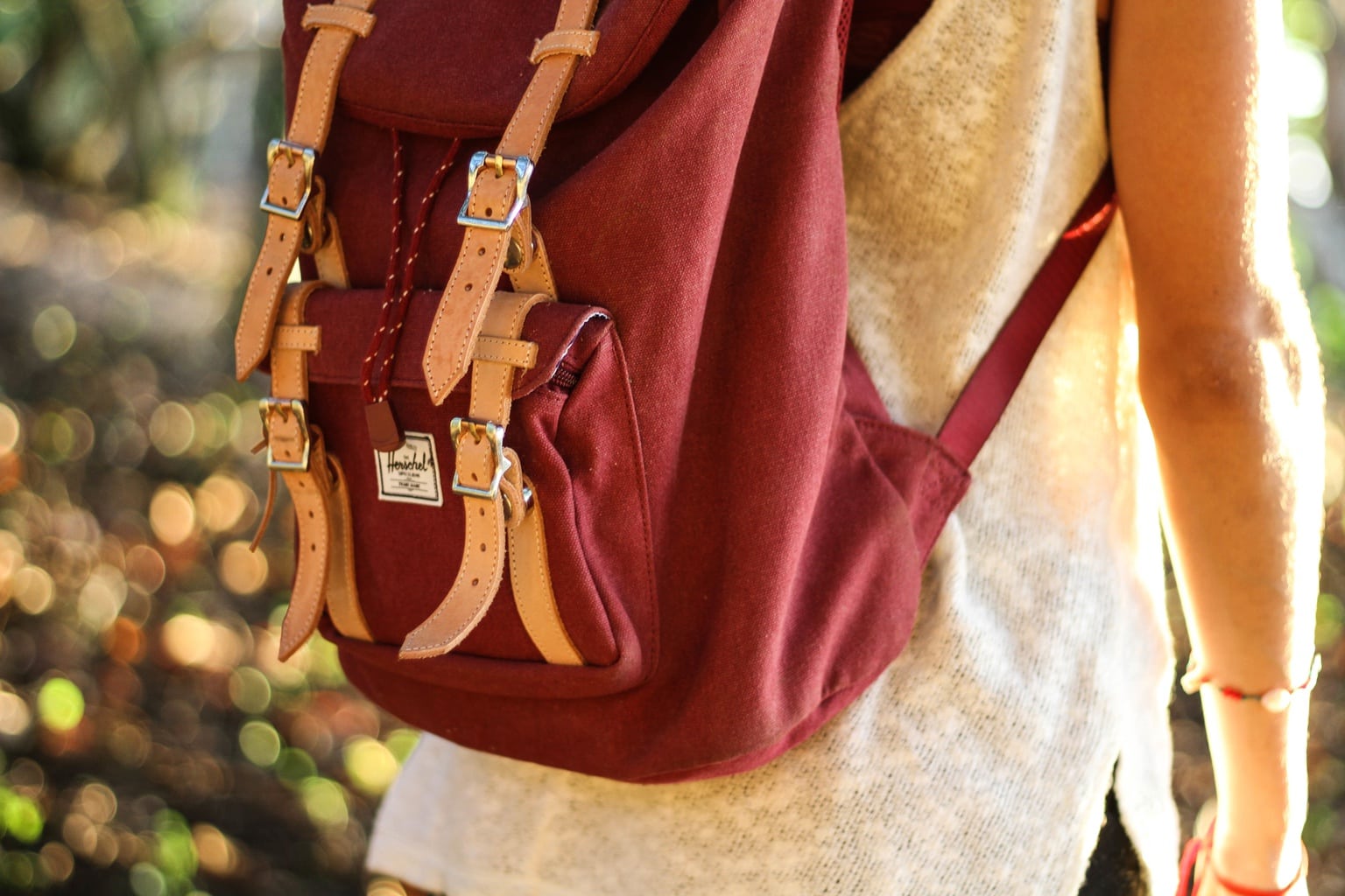 Red backpack, white top