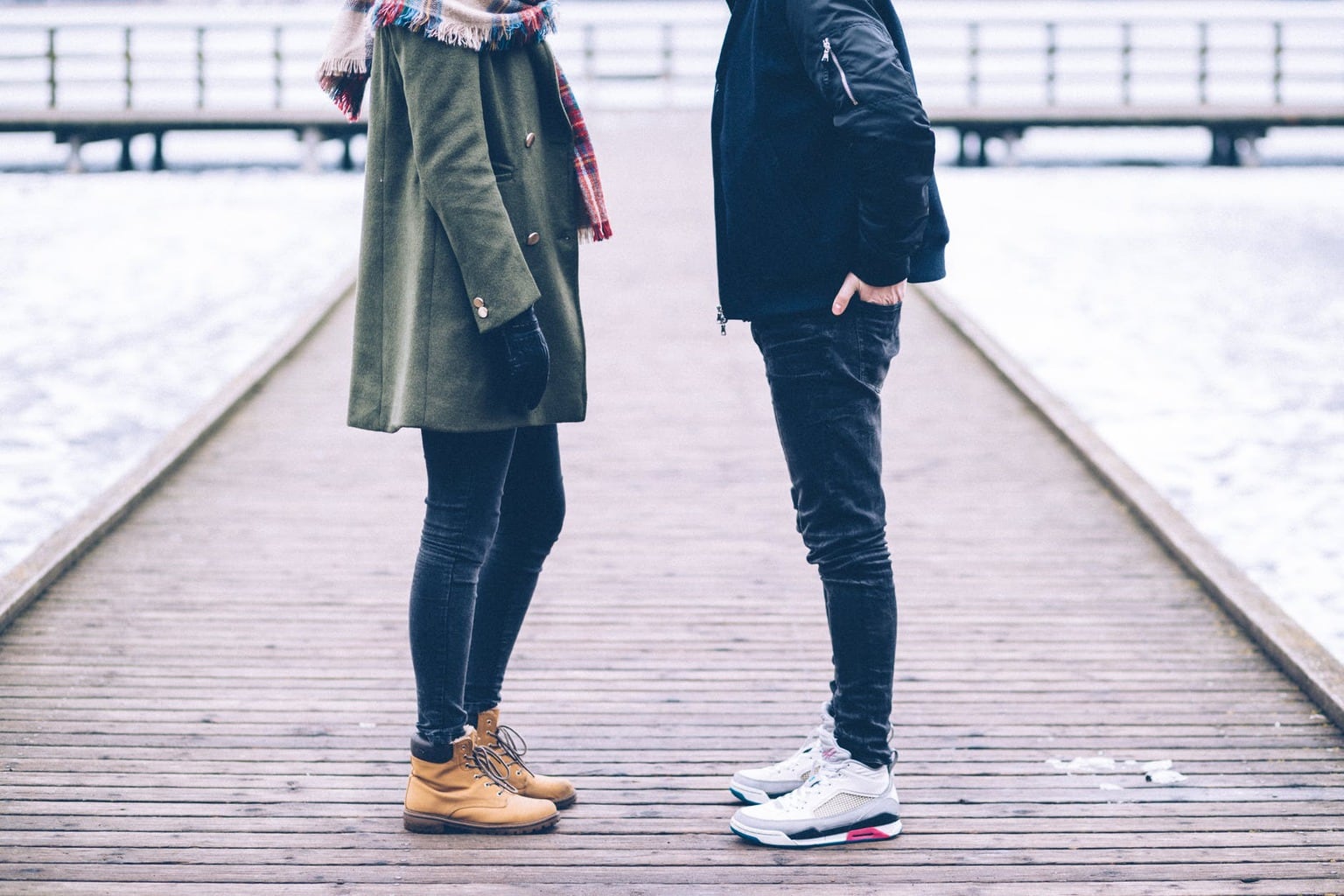 Man and woman standing in snow