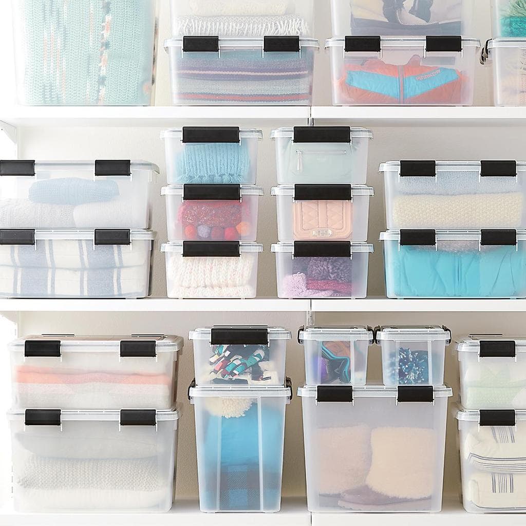 Weathertight clear storage bins for closet organization.