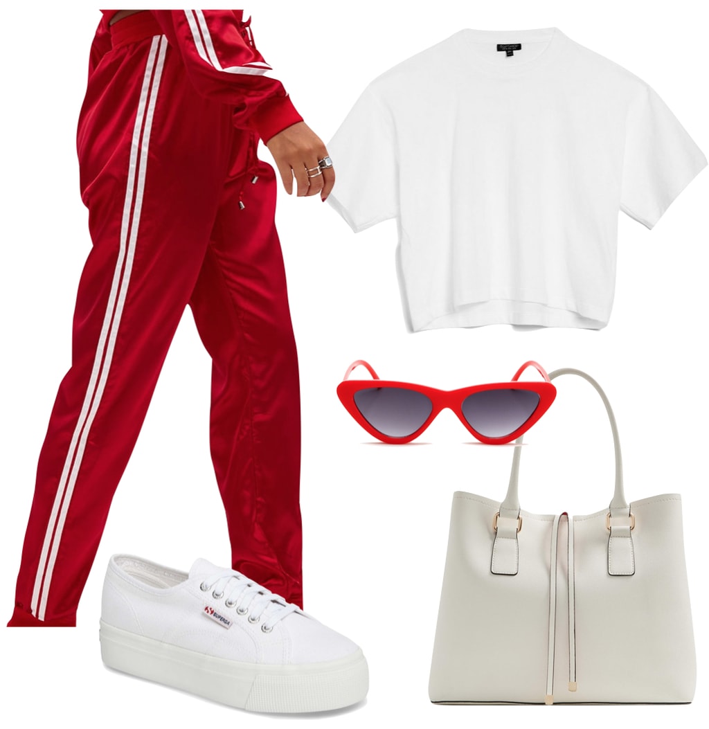 Dakota Fanning Outfit: red and white striped track pants, a white boxy t-shirt, red cat-eye sunglasses, a white handbag, and white platform low-top sneakers