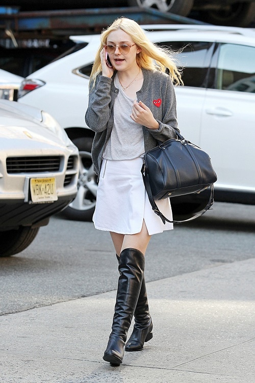 Dakota Fanning white skirt, knee high boots, gray cardigan