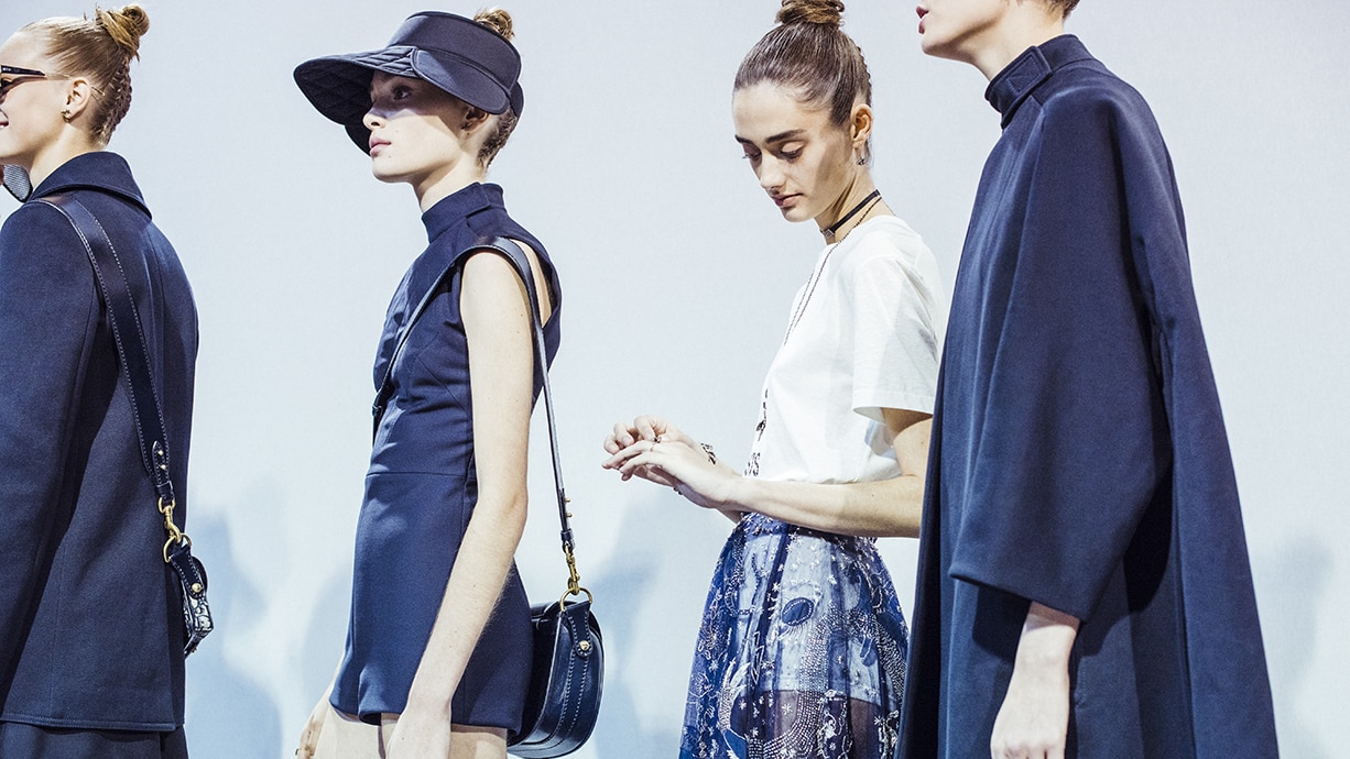 Christian Dior Spring 2017 photo: Models wearing navy blue outfits and hats