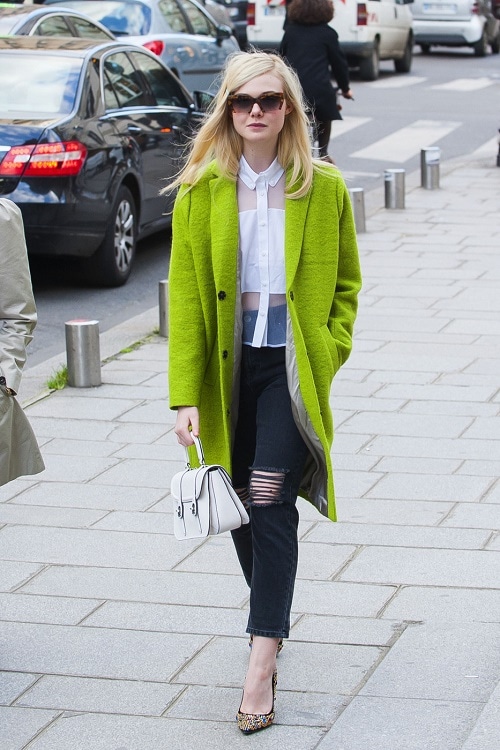 Elle Fanning lime coat, ripped jeans, sheer blouse