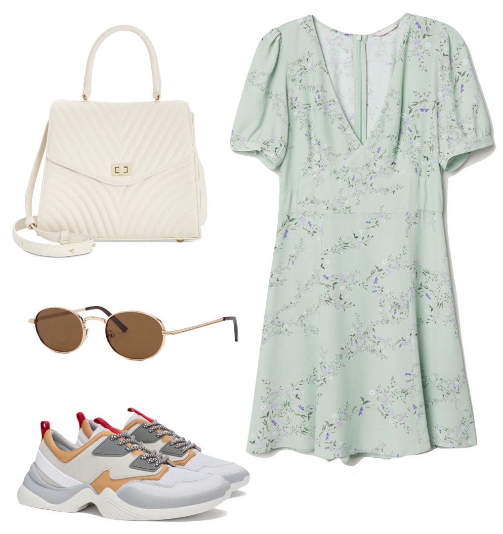 Elsa Hosk Outfit: green floral print puff sleeve mini dress, white quilted handbag, round metal frame sunglasses, and multicolor sneakers