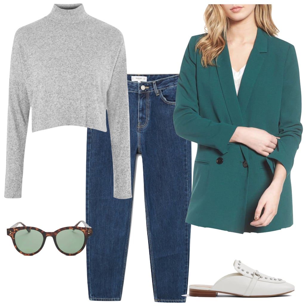 Emilia Clarke Outfit: gray mock neck top, green oversized double-breasted blazer, dark wash straight leg jeans, white loafer mules, and round tortoise sunglasses