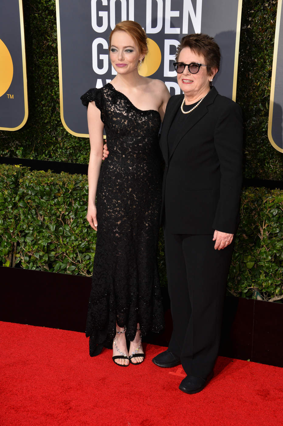 Emma Stone in a black Louis Vuitton one shoulder gown at the 2018 Golden Globe Awards red carpet