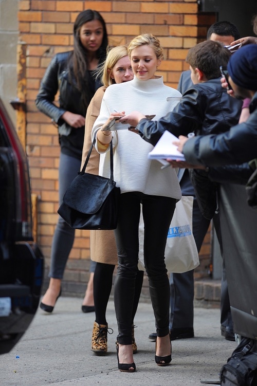 Elizabeth Olsen white turtleneck and leather skinnies