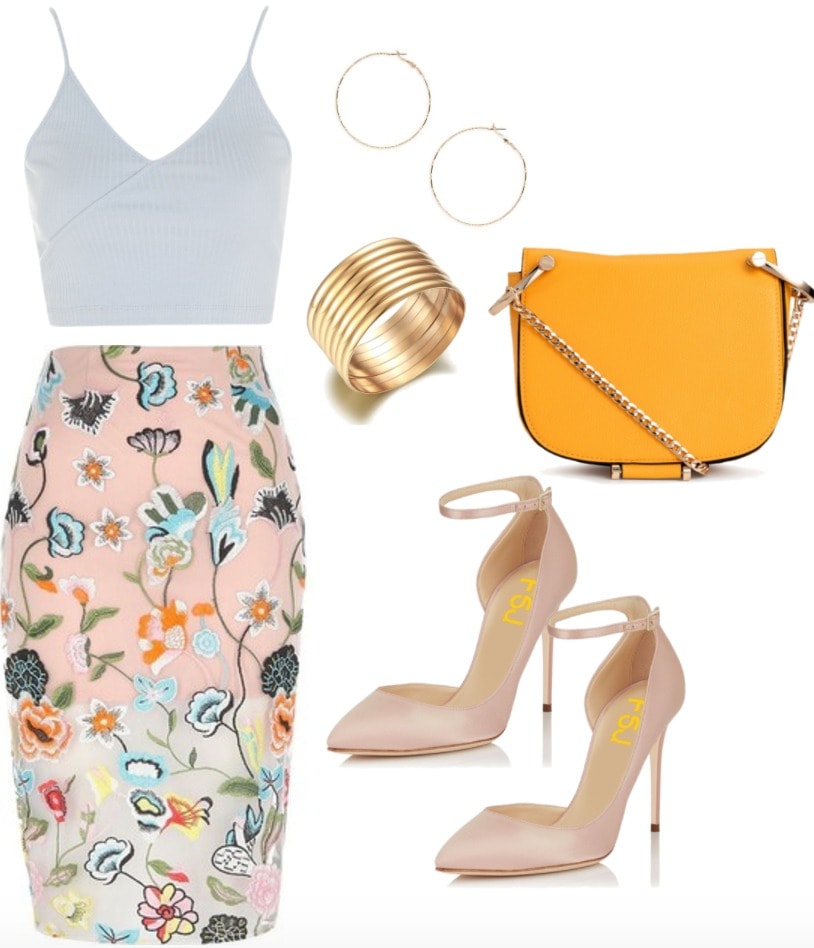 Embroidered skirt outfit: Fierce & flirty embroidered midi skirt in pink with a pale blue crop top, pink pointed toe pumps, orange chain strap bag, gold bangles and gold earrings