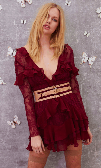 red ruffle dress, platform heels, star studs, fur jacket, red lipstick, lace stockings, turtleneck, star headband