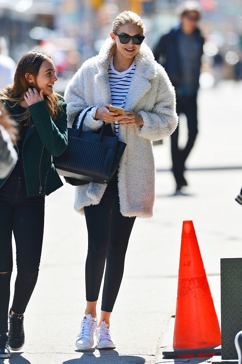 Gigi Hadid fuzzy coat and sneakers