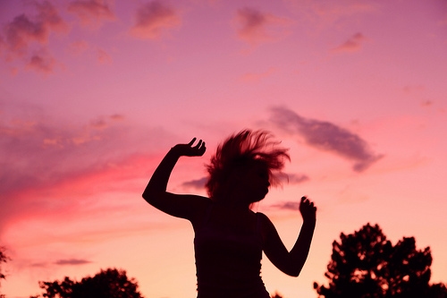 Girl jumping into the air while dancing