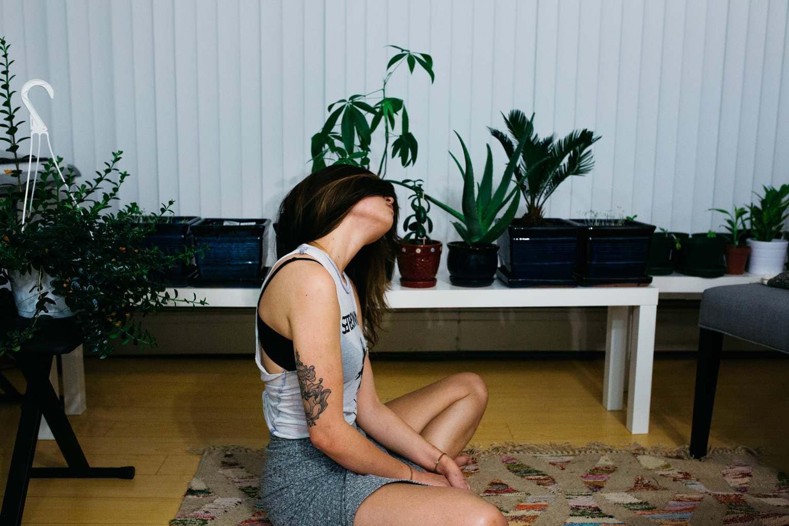 Girl doing yoga in her apartment