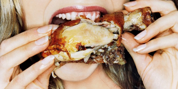 Girl eating wings
