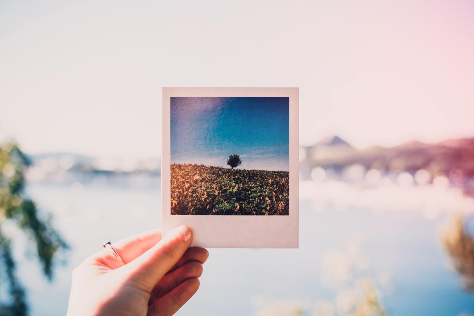 Girl holding a polaroid