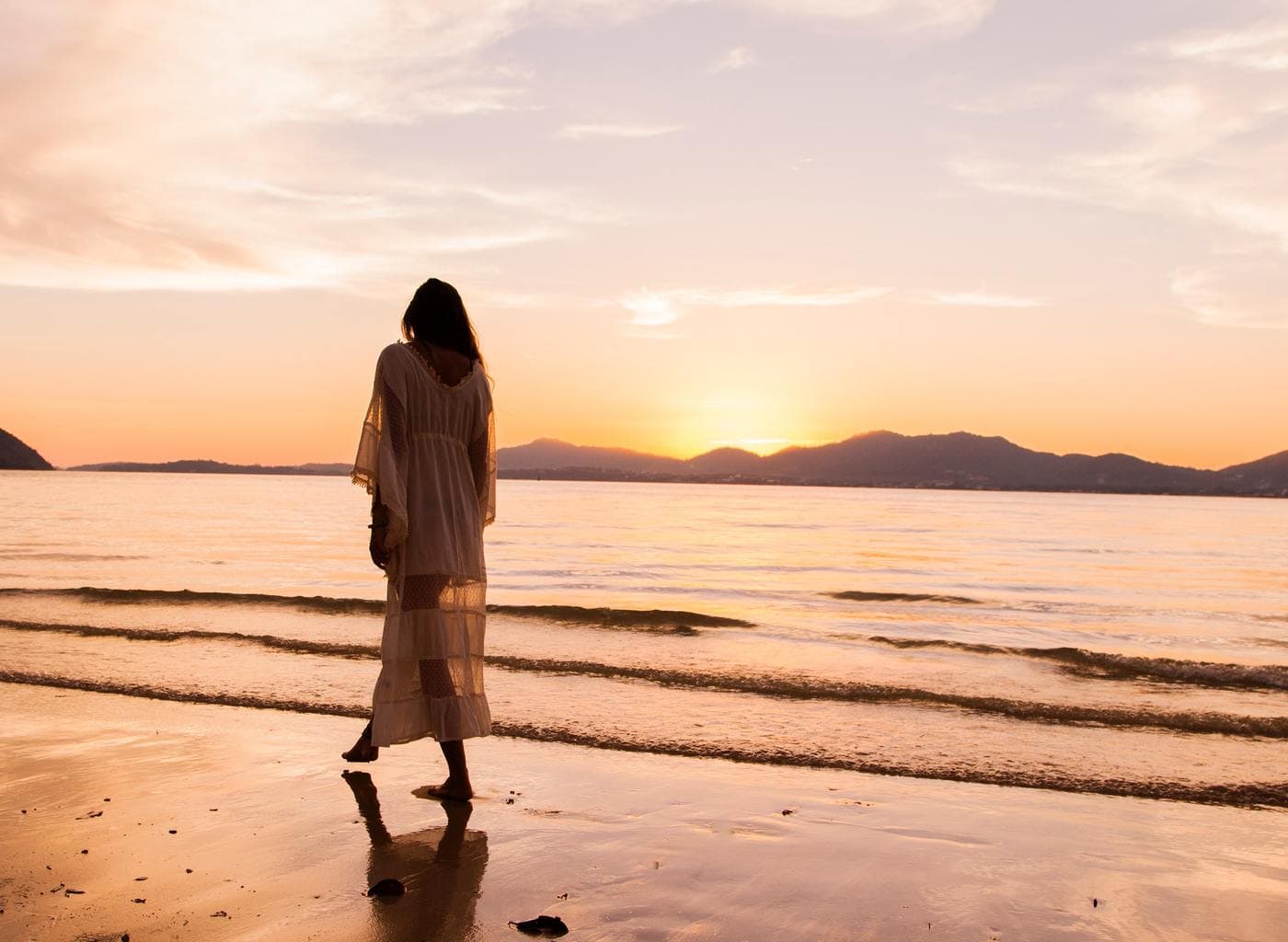 Girl on the beach in a dress