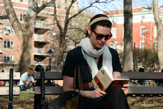Girl reading a book in the park