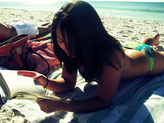 Girl reading on the beach