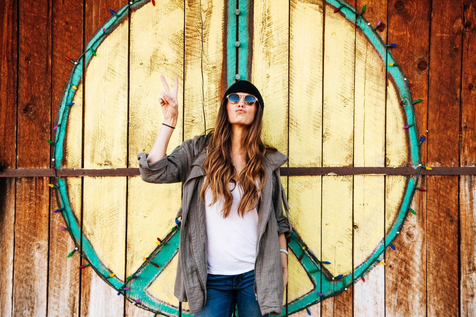 Girl throwing up the peace sign