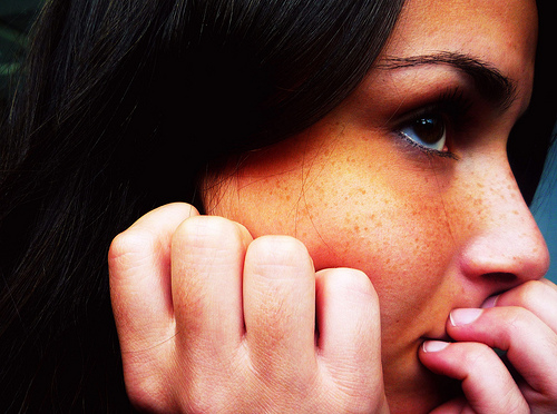 Girl with hands on face