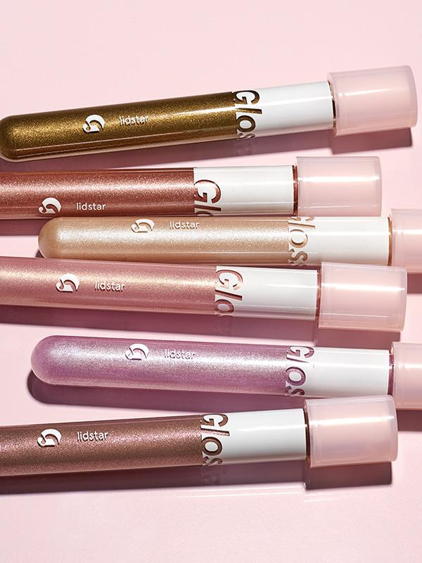 Close-up photo of Glossier Lidstar in shades (from top to bottom) Herb, 