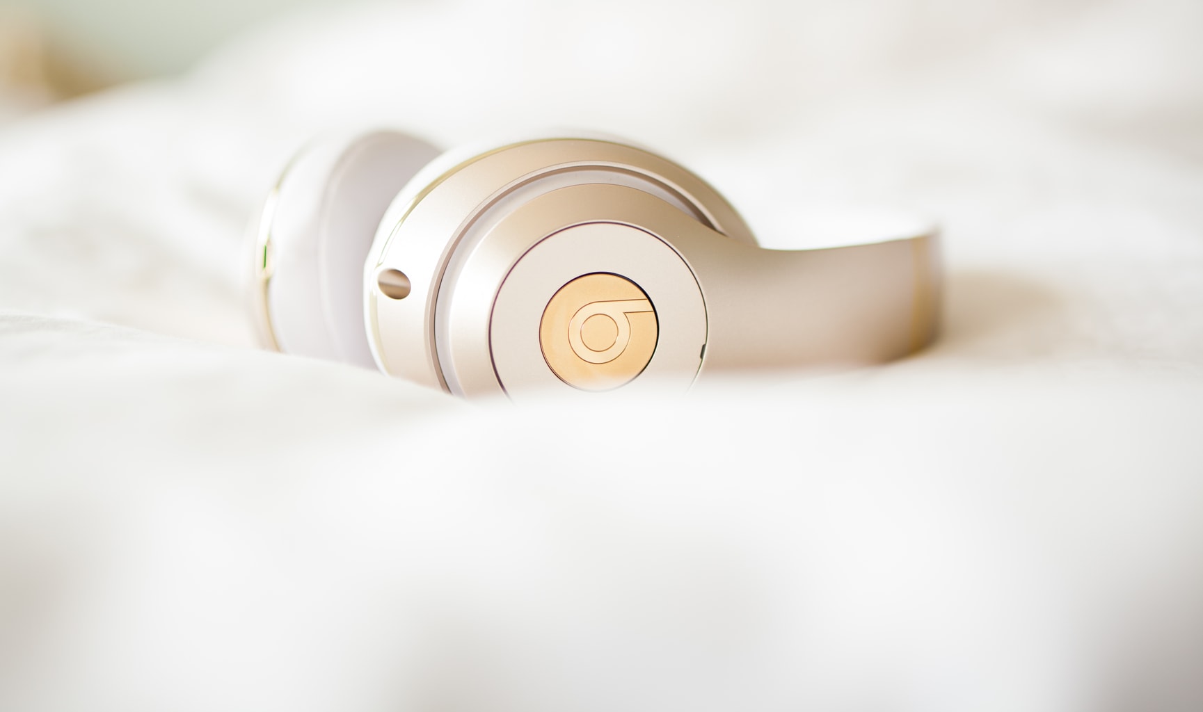Gold wireless Beats by Dre headphones