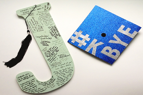 Initial letter guestbook and graduation cap
