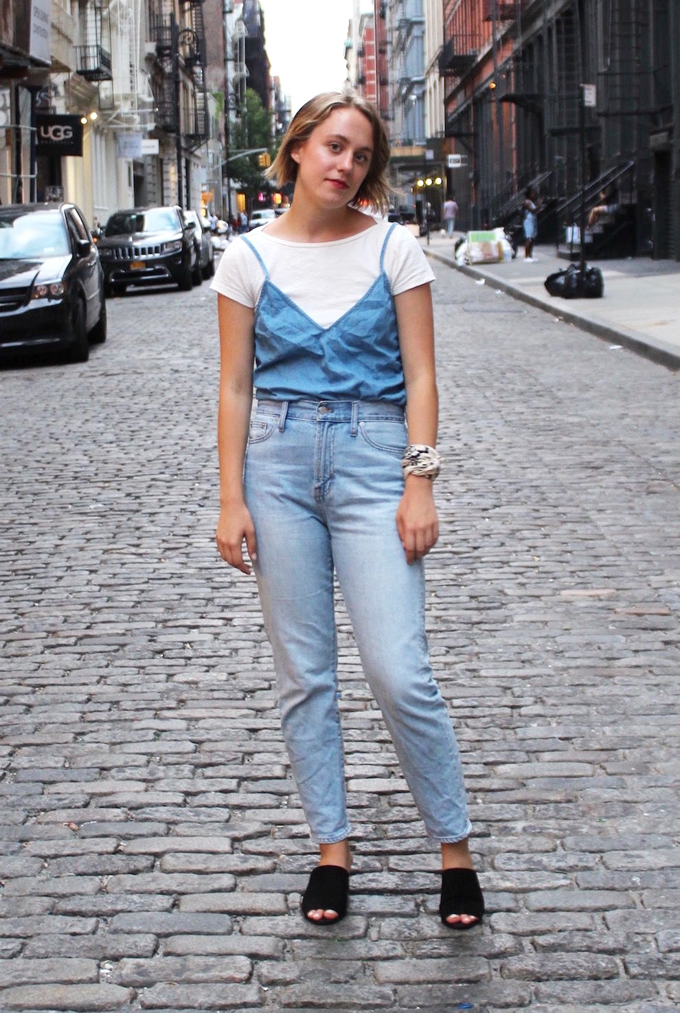 GWU fashion - Natalie wears a cute outfit for her fashion internship consisting of mom jeans, a cami over a white tee shirt, and mules