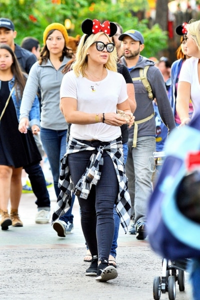 Hilary Duff in jeans, a tee, and flannel shirt