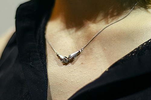 Holding hands necklace