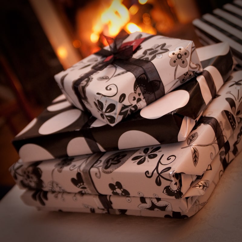 Holiday gifts wrapped in black and white paper