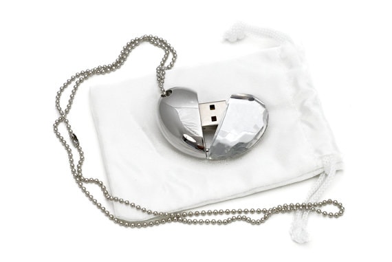 USB heart locket on white cloth