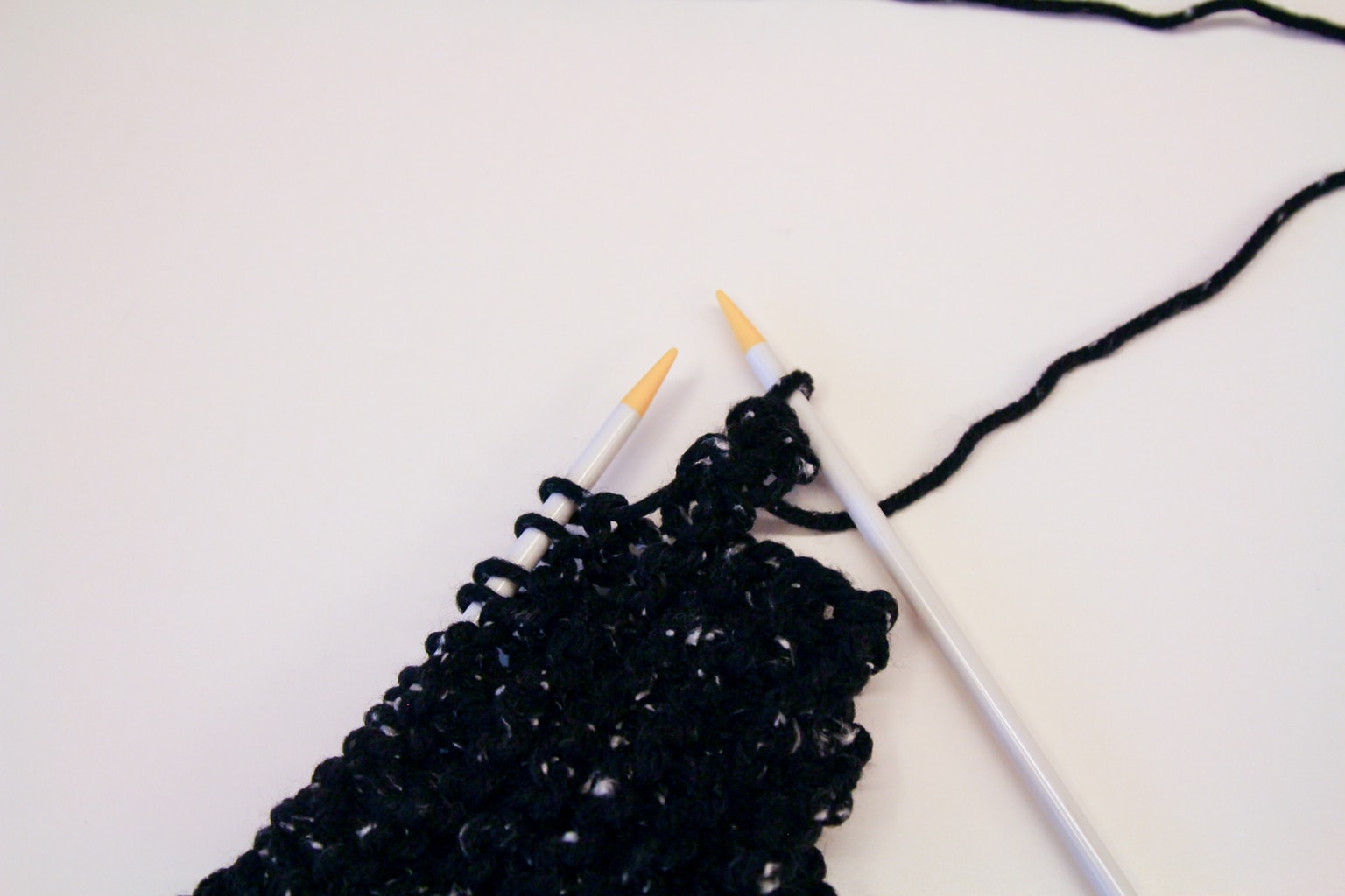 Learn to knit a scarf by following this easy tutorial.