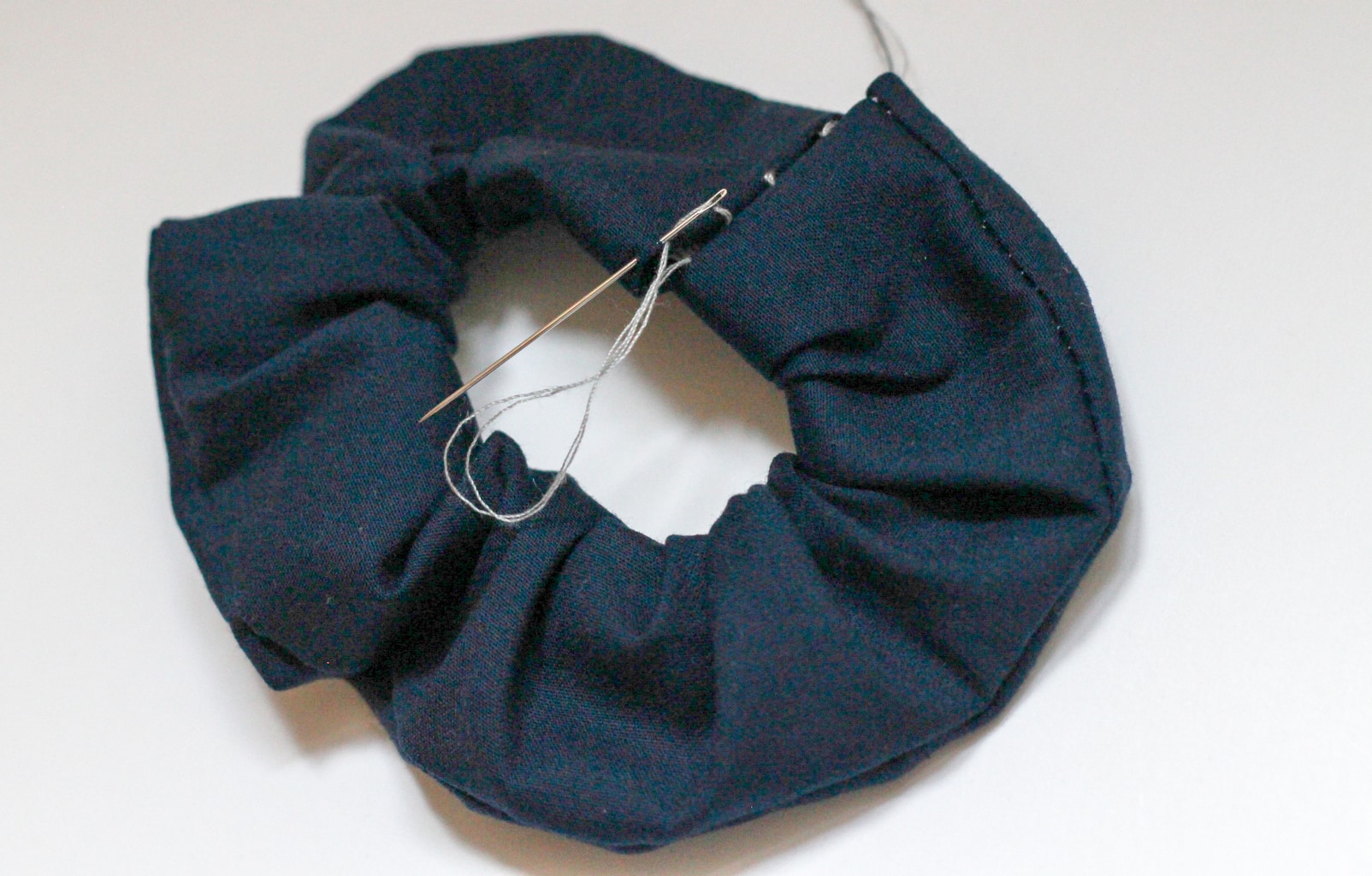 DIY scrunchies: Sew the ends of the scrunchie together with a needle and thread