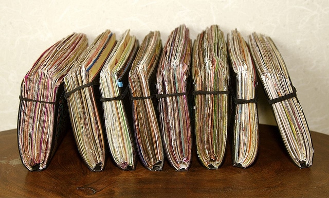 row of journals stacked next to each other